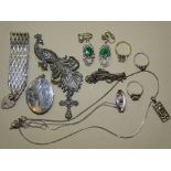 A marcasite-set silver peacock brooch, a similar buggy racing brooch, a silver bracelet and other