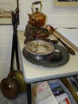A copper warming pan and one other with  turned wood handles, a copper spirit kettle on stand, a