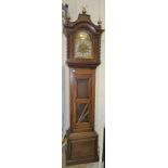 A modern chiming longcase clock, the oak case with brass arch dial and three-train movement striking