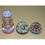 Two Strathearn millefiori art glass paperweights and a millefiori glass scent bottle and stopper