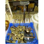 Five brass and iron trivets, a brass bell and other brass and metalware.