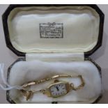 A lady's 9ct-gold-cased wrist watch on 9ct gold bracelet, 12.3g, (boxed).