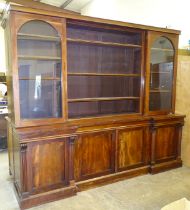 A Victorian mahogany breakfront bookcase, the upper section with central open adjustable shelves