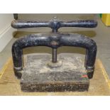 A cast iron book press, 42cm wide, 35cm high, with name plaque John Smith, 102 Old Town Street,