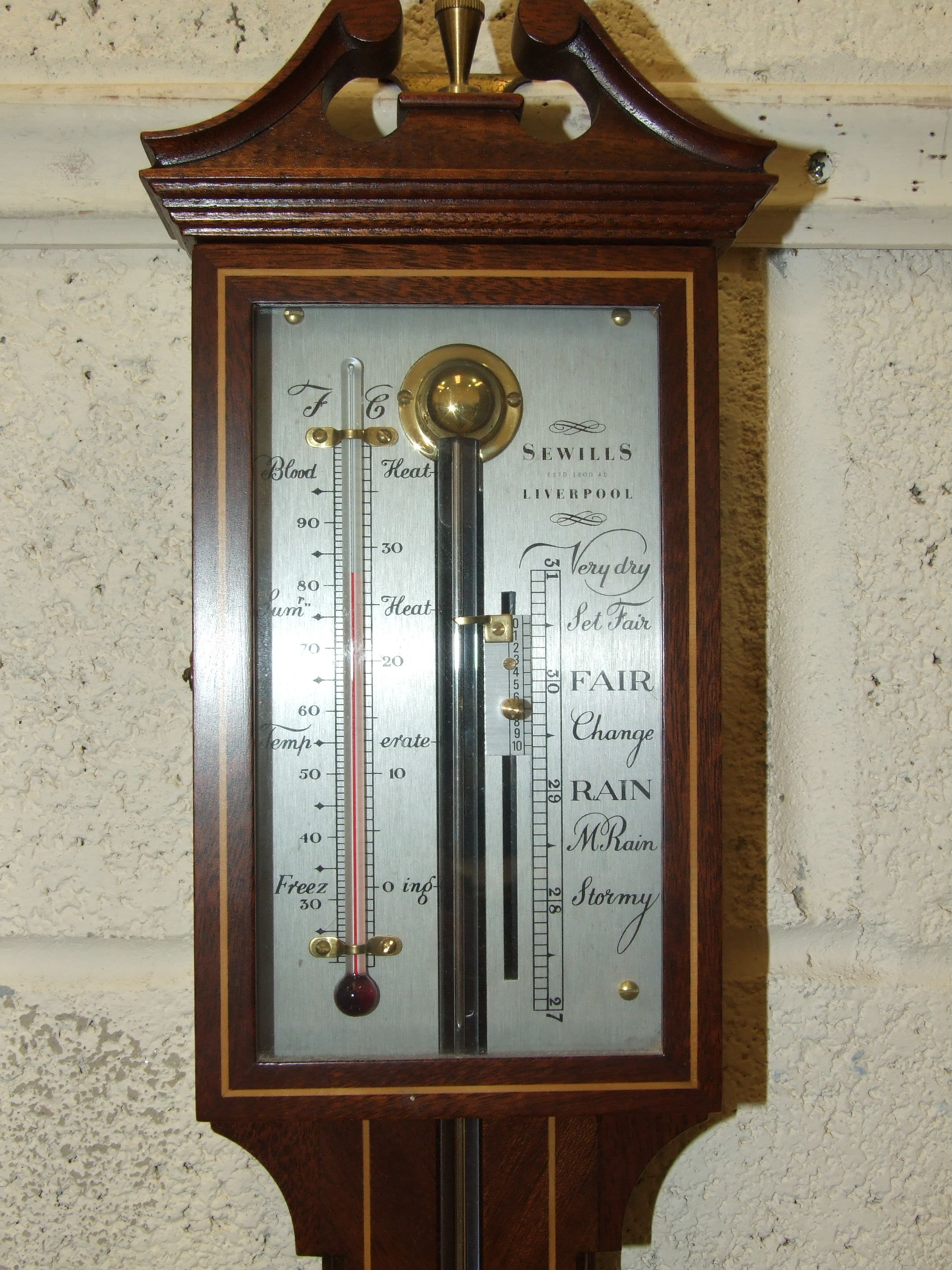 A modern stick barometer by Sewills, Liverpool, 96cm.