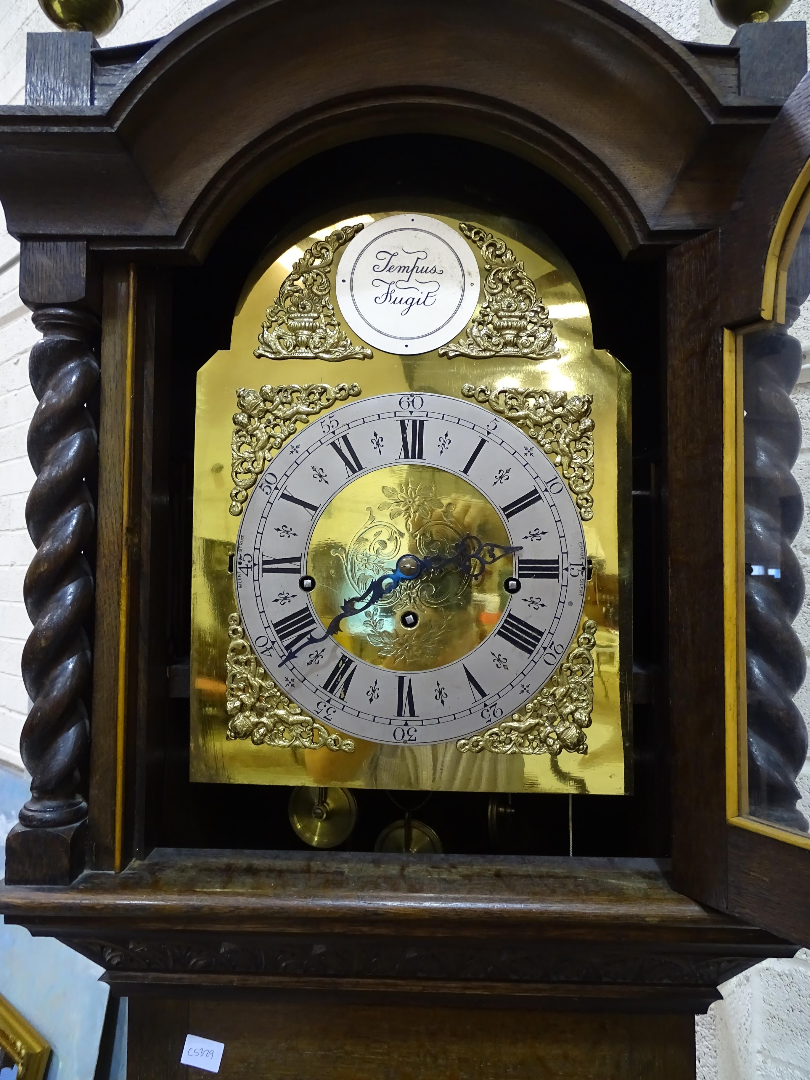 A modern chiming longcase clock, the oak case with brass arch dial and three-train movement striking - Image 2 of 2