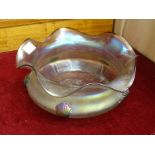 A Loetz style iridescent glass bowl with shell shape appliques and wavy rim, 25cm diameter, 11.5cm