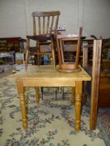 A modern pine square-top kitchen table, 86cm, a folding clothes airer, a lathe back elm and beech