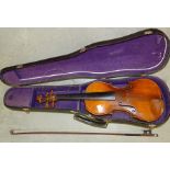 A full size violin with a one-piece back, and bow in case.