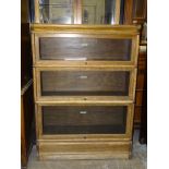 A Globe Wernicke three-section oak bookcase on base, 86.5cm wide, 120cm high, 31cm deep.