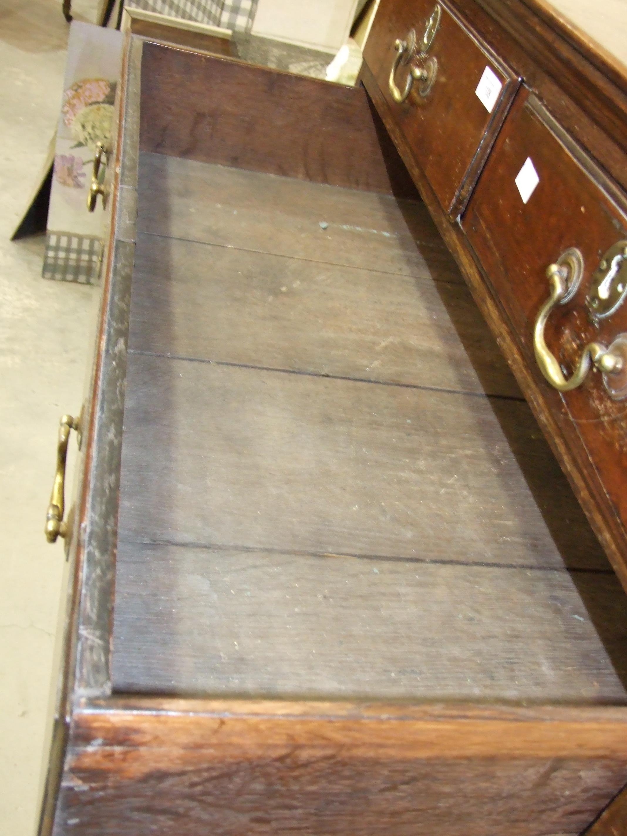 A Georgian oak chest on stand, the chest with two small and three long graduated drawers, the base - Image 3 of 7