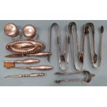 A six-piece silver dressing table set, M Bros, Birmingham 1905, a plated nail cleaner and seven