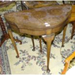 A mid-20th century walnut fold-over-top card table on slender cabriole legs, 77cm wide, a walnut