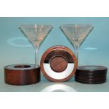 A pair of Linley walnut and polished nickel tea light holders, 10cm diameter, 4cm high, five similar