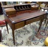 A stained mahogany desk, the rectangular top with low back fitted with two drawers and pigeon holes,