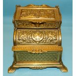 Adolph Frankau & Co, a brass combined Vesta holder/ashtray with embossed decoration, the lid of