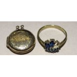 A 9ct gold gem-set ring, (one setting vacant) size N½, 1.9g and a 9ct gold locket, 3.3g, (2).