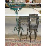 A pair of wire-work plant stands, 77cm high, top 26cm square, a similar smaller stand and a larger