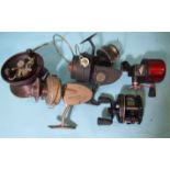 A Charles Alvey Bakelite and metal sea fishing reel, with large bale arm, twin handles and star