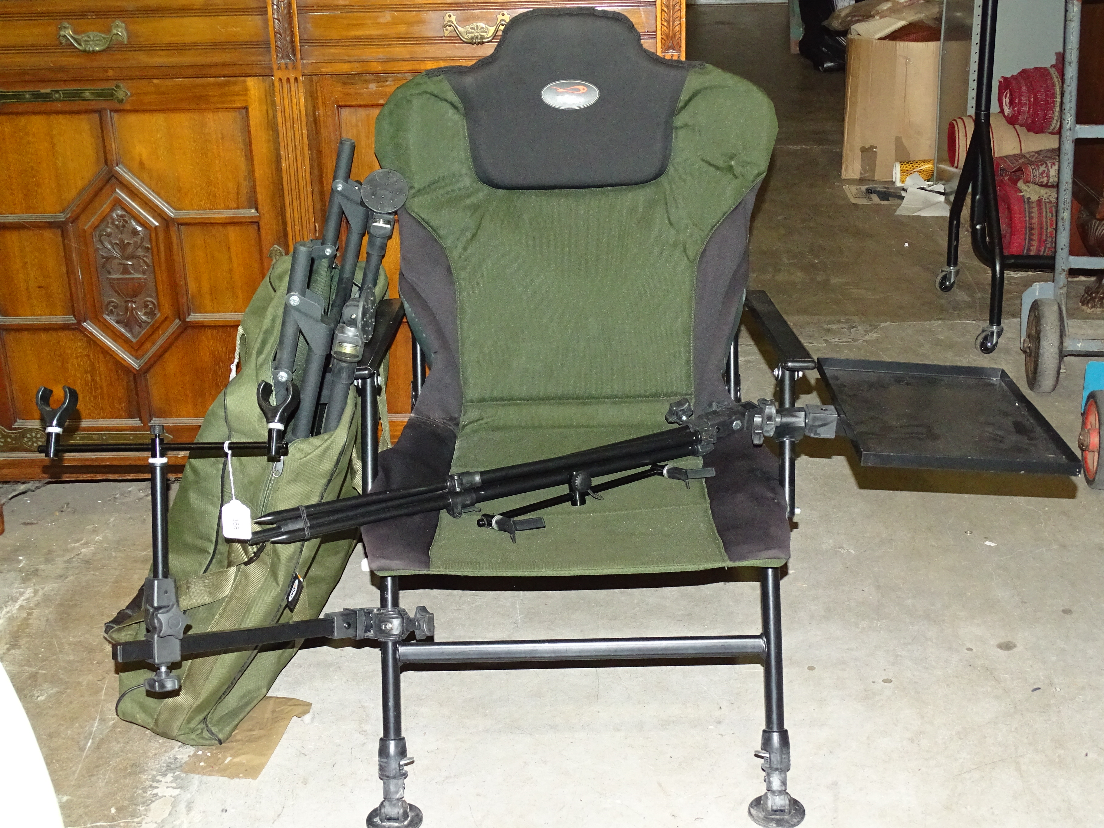 A TF Gear fishing seat with adjustable legs, tray and rod holders.