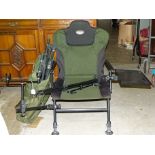 A TF Gear fishing seat with adjustable legs, tray and rod holders.