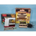 A Vulcan Classic child's electric sewing machine, (boxed), a Tomy Caveman game and a Petite Super