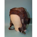 A WWII pilot's leather helmet, C-type, in poor condition, marked Size 4½ to 7¾ A [crown] M 22C/452.