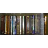 A large collection of role-playing game source books, including Vampire The Requiem, Exalted,