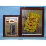 A vintage oak-framed mirror advertising WD & HO Wills "Gold Flake" cigarettes, decorated with a