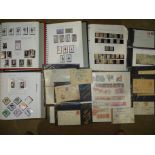 A mint and used collection of Spanish stamps in four albums and a stock book, also a selection of