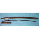 An antique Japanese sword, the signed tang with four holes, the 5mm thick 65cm blade with overall