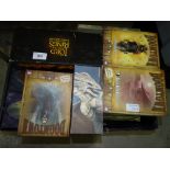 A collection of various opened board games, including Warhammer Underworlds 'Nightvault', Z-Man '