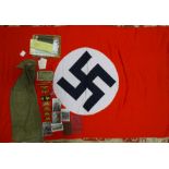 A Third Reich Nazi flag, red cotton with printed black swastika on white cotton ground, 116 x 190cm,