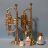 Two trumpets by Holton, Wis, USA, numbered 545278 and 592142, in carrying bag with accessories.