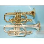 A Signature brass cornet numbered 2087 and a Holman silver-plated cornet numbered 857922, (both