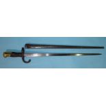A French 1876 pattern bayonet, the 52cm blade etched St Etienne 1876, with metal scabbard.