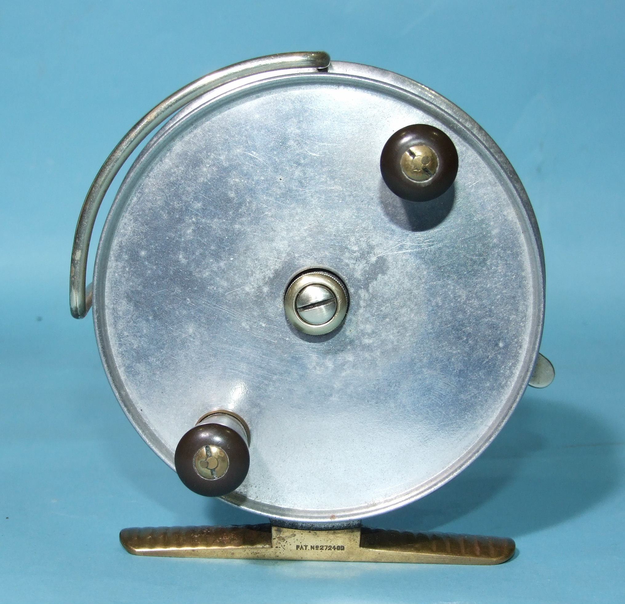 A Hardy Bros Ltd alloy 4½'' trolling reel with brass foot, line guard, drag lever and Bakelite
