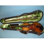 A full-size violin with two-piece back labelled "Boosey & Co, London", cased with three bows.