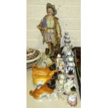 A Continental ceramic figure of a young man holding a bugle draped with the Union Jack, 53cm high, a