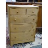 A modern small light wood bow-fronted chest of two short and three long drawers, 59cm wide, 83cm