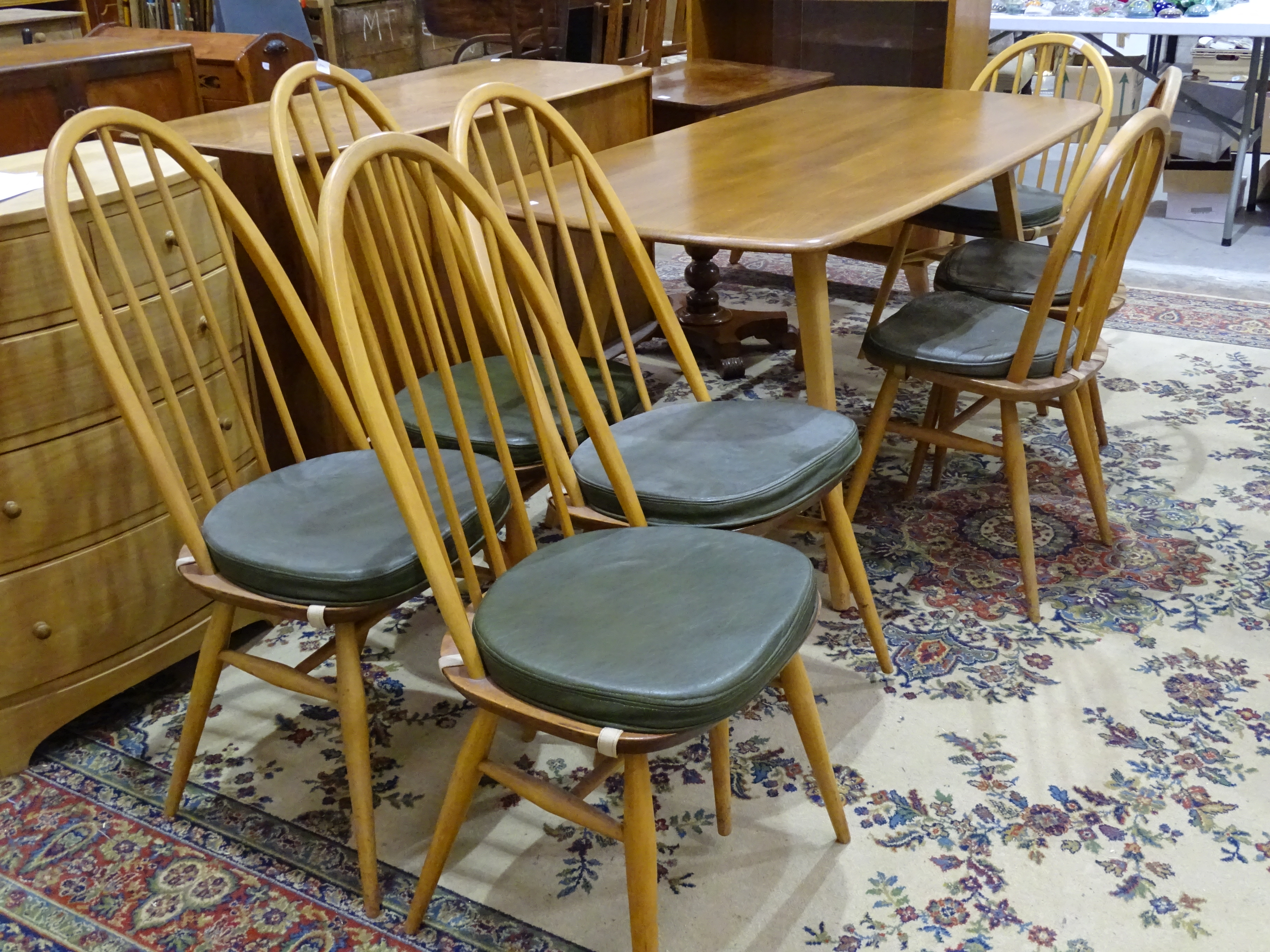 An Ercol light elm dining table, 151 x 76cm, four high hoop stick-back chairs, three smaller similar - Image 2 of 2