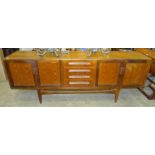 A G-Plan Fresco teak sideboard fitted with an arrangement of four drawers and four cupboard doors,