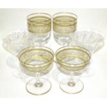 Five gilt-decorated wine glasses, five matching Champagne glasses, a decanter and twelve Webb