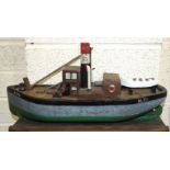 A wooden scratch-built model of the fishing vessel H71, 45cm long, various cigarette cards in albums