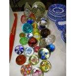 A collection of thirty various modern glass paperweights.