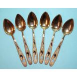 A set of six Russian silver-gilt teaspoons with enamel decoration, marked *875, three niello