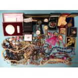 A quantity of costume jewellery and watches.