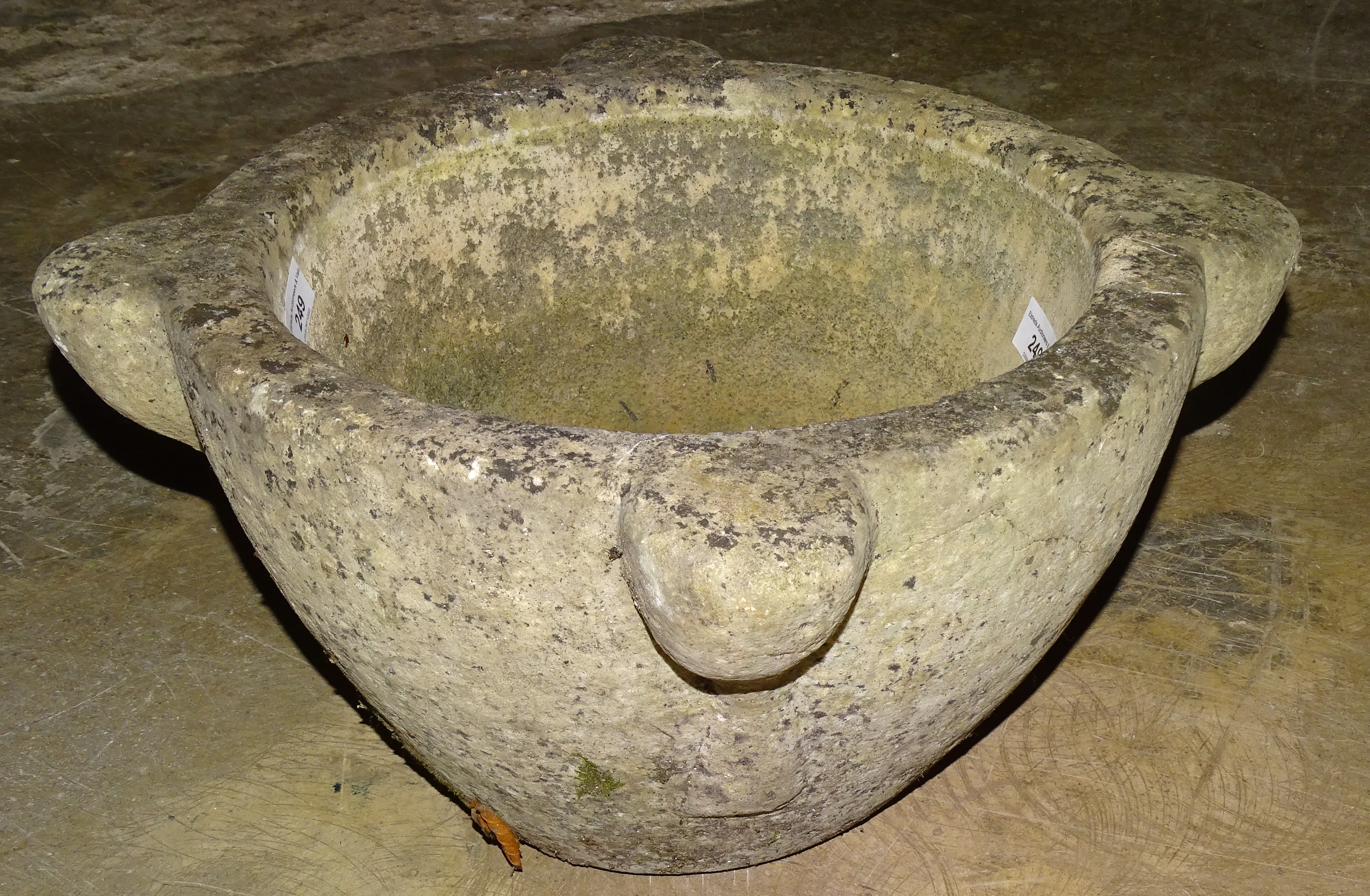 A large stone mortar, 48cm diameter, 24cm high.