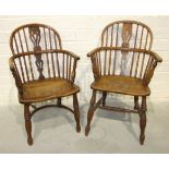 A 19th century yew wood and elm comb-back Windsor chair with crinoline stretcher and another elm