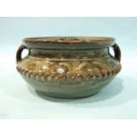 Style of Ladi Kwali, a glazed stoneware dish and cover with impressed decoration, seal